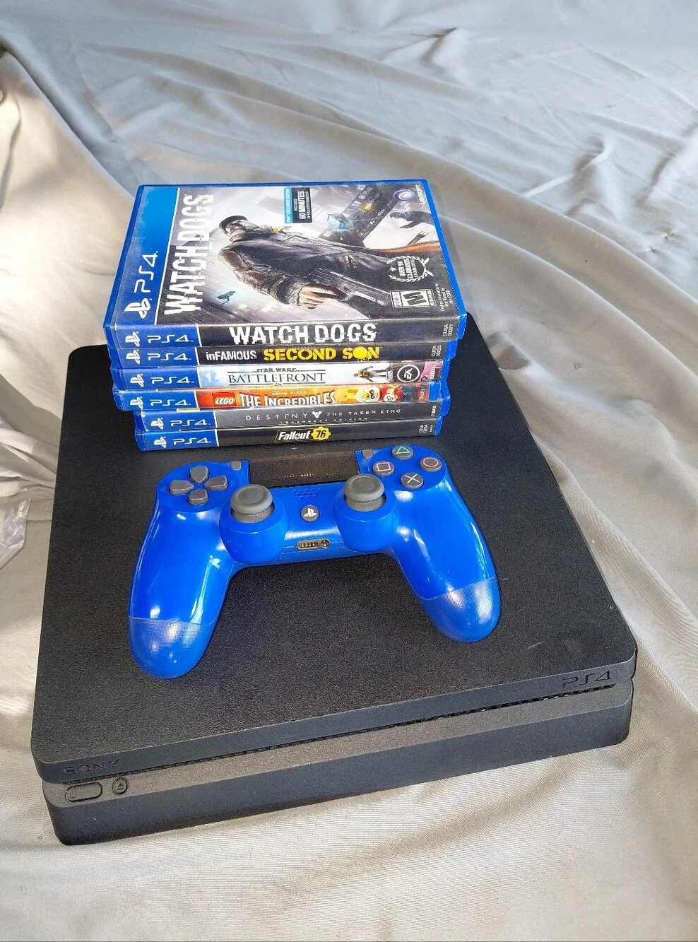 Sony PS4 Slim in Black with Bright Blue DualShock Controller and Game Bundle